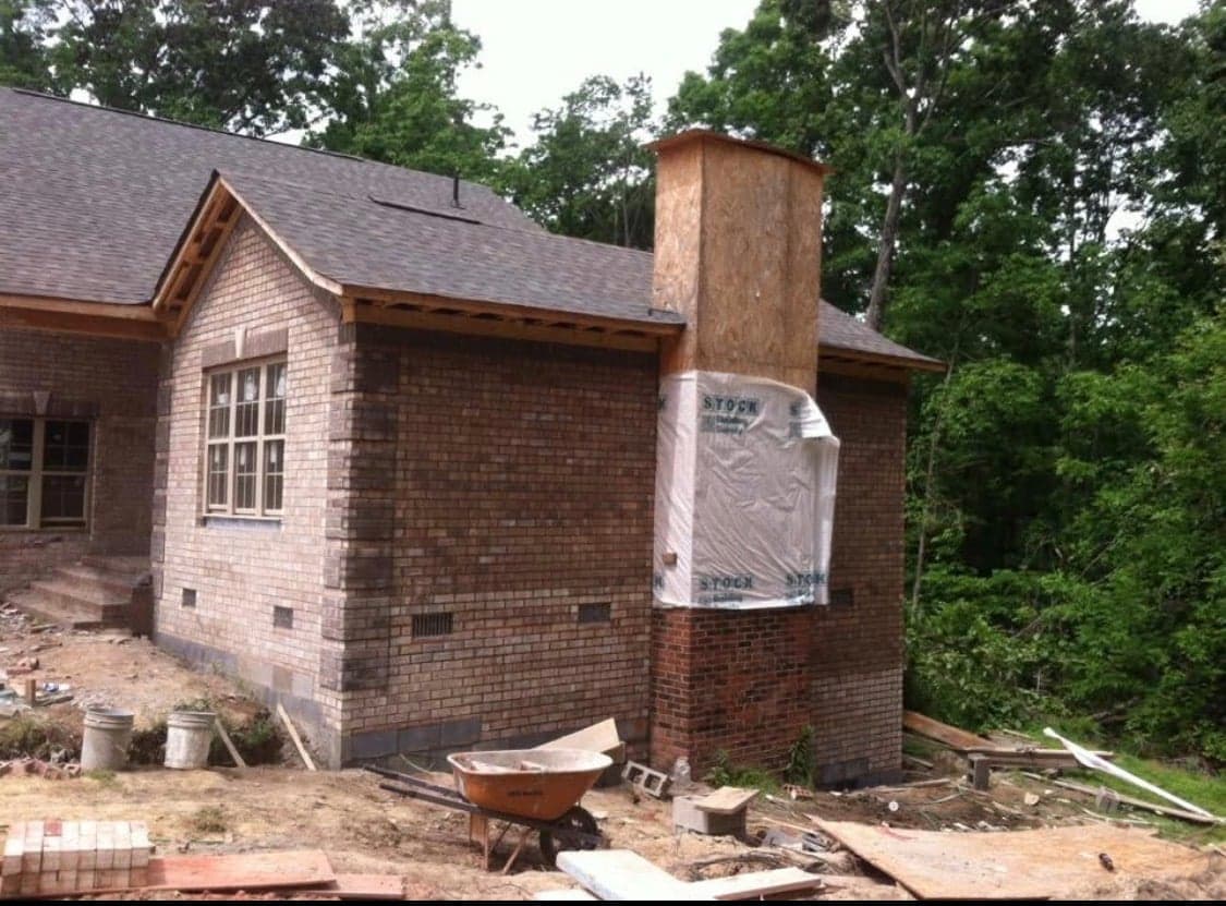 Brick home with double garage under construction