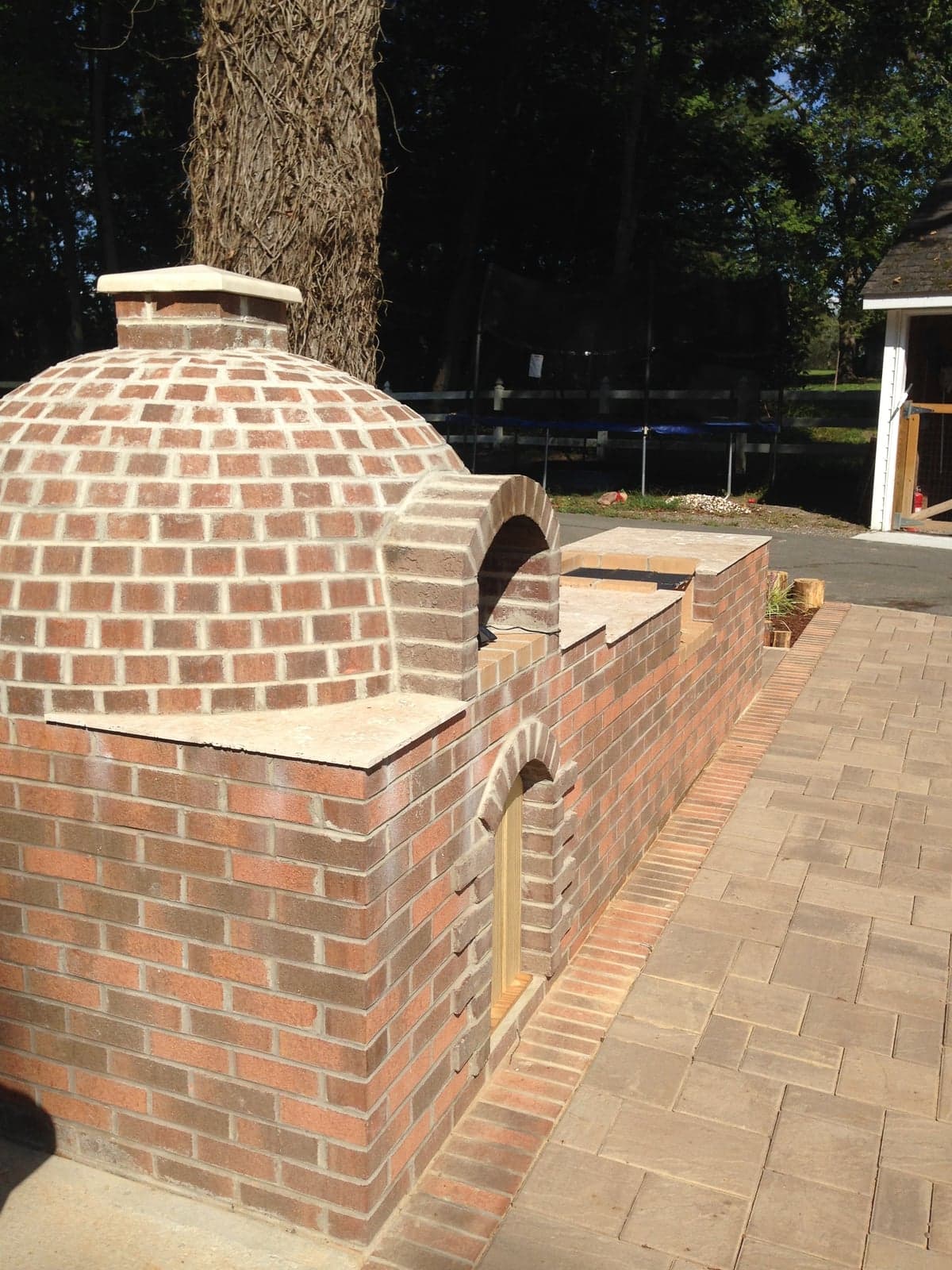 Brick smoker oven with arched dome detail