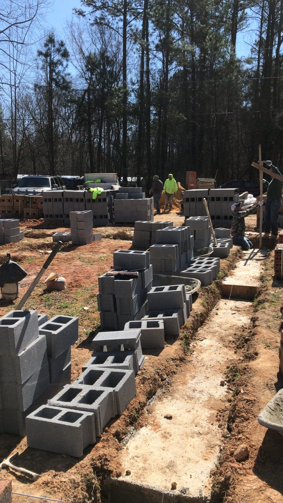 CMU block foundation with rebar staged on a jobsite