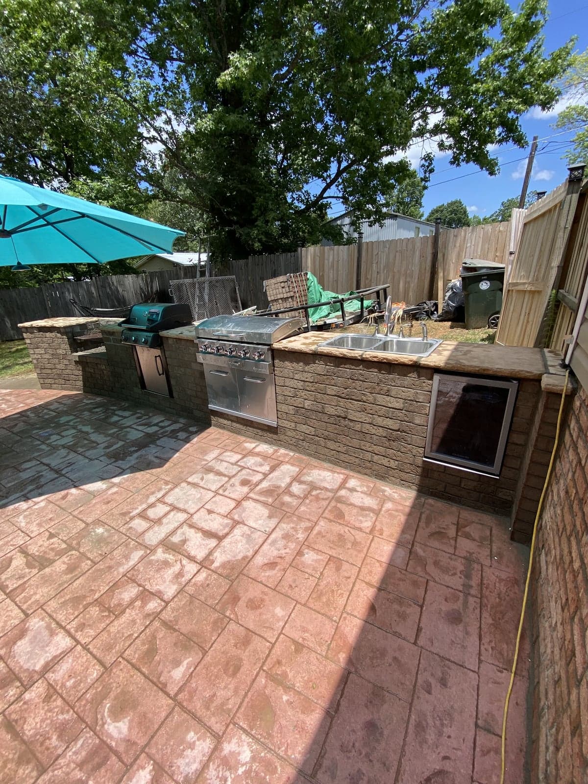 Brick outdoor kitchen with built-in grill